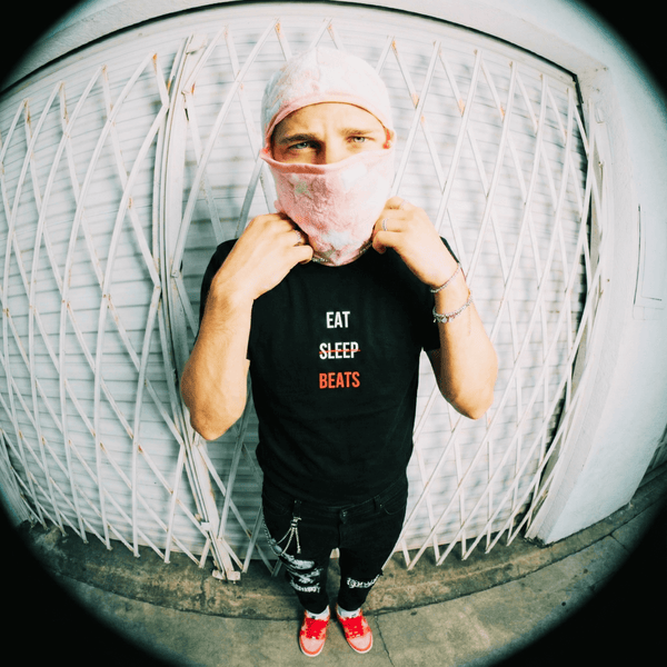 Rapper in an Eat Sleep Beats tee photographed on the street with a fisheye lens