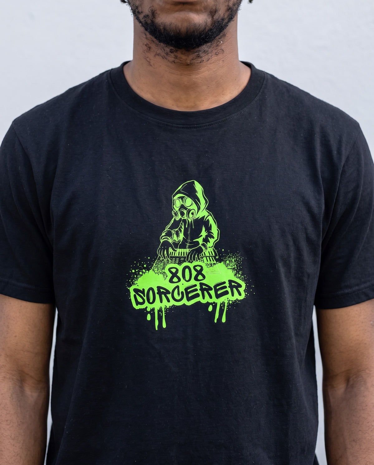 Model wearing the 808 Sorcerer t-shirt in Black, print close-up