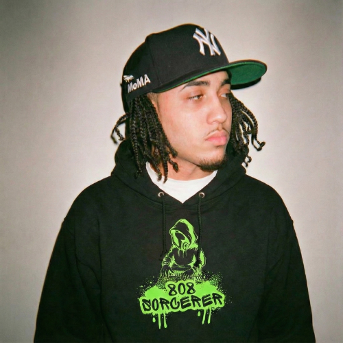 Music producer wearing a 808 sorcerer Ghostnote hoodie