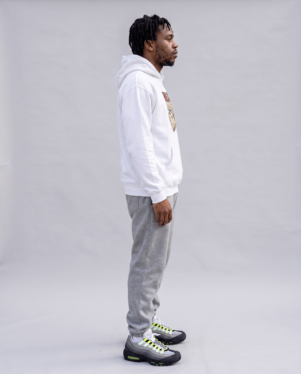 Model wearing the Beat Maker Hoodie in White, side profile