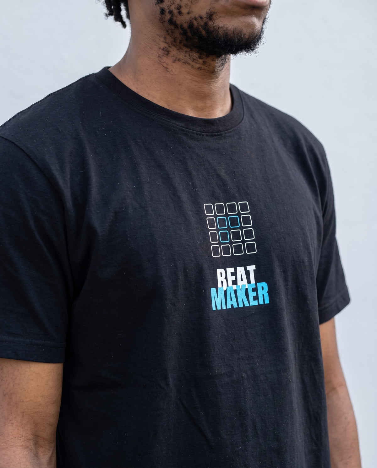 Model wearing the Beat Maker t-shirt in Black, print close-up