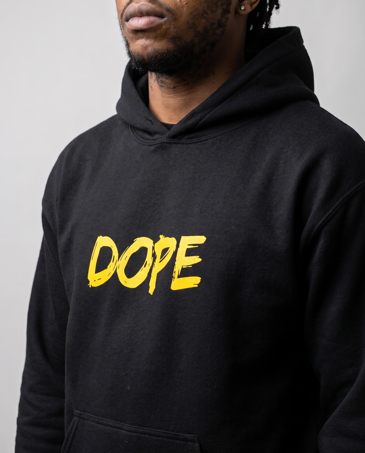 Model wearing the Dope Hip Hop Hoodie in Black, print close-up