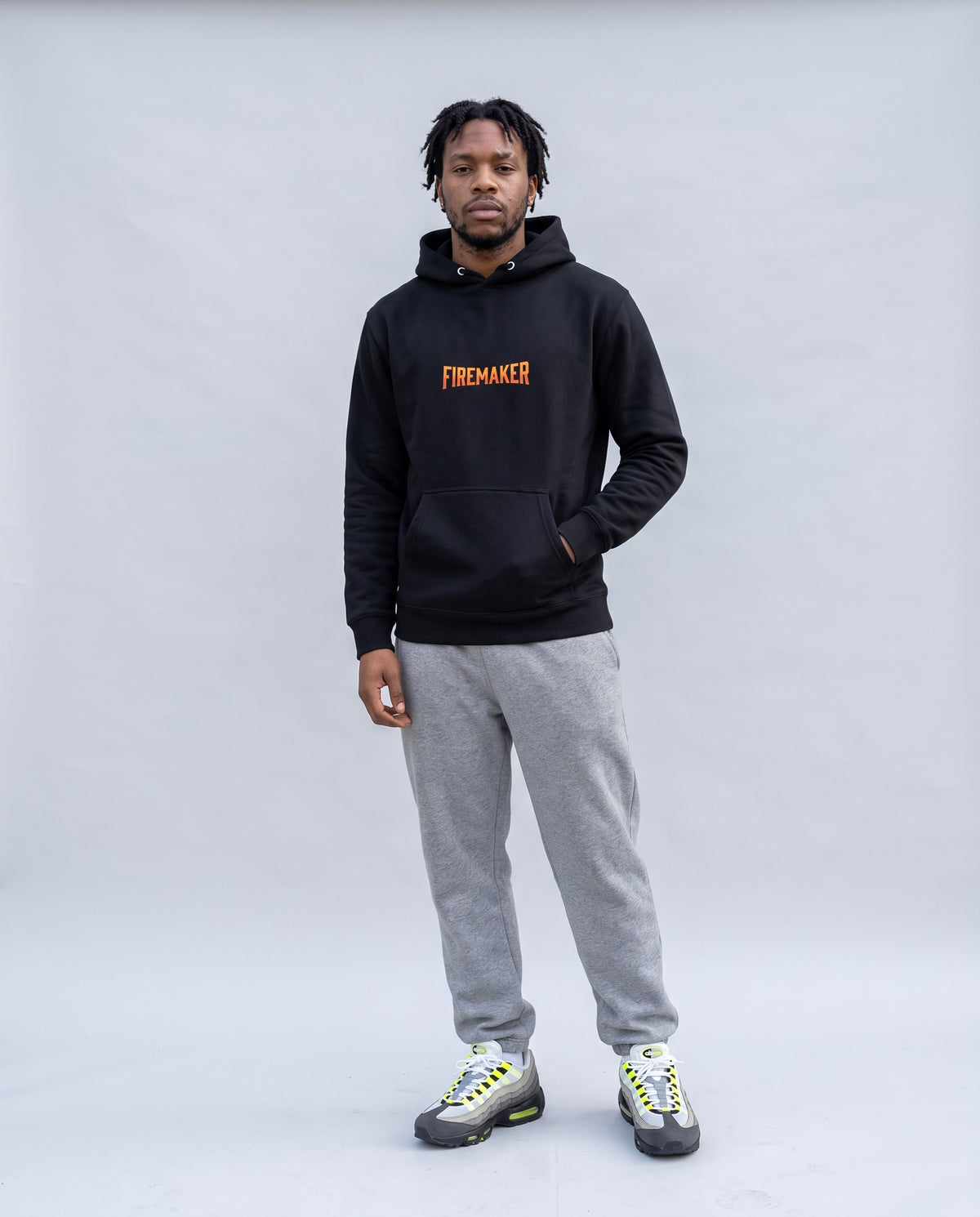 Model wearing the Firemaker Hoodie in Black, full length