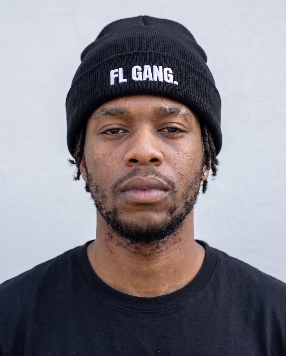 Model wearing the FL Gang beanie in Black