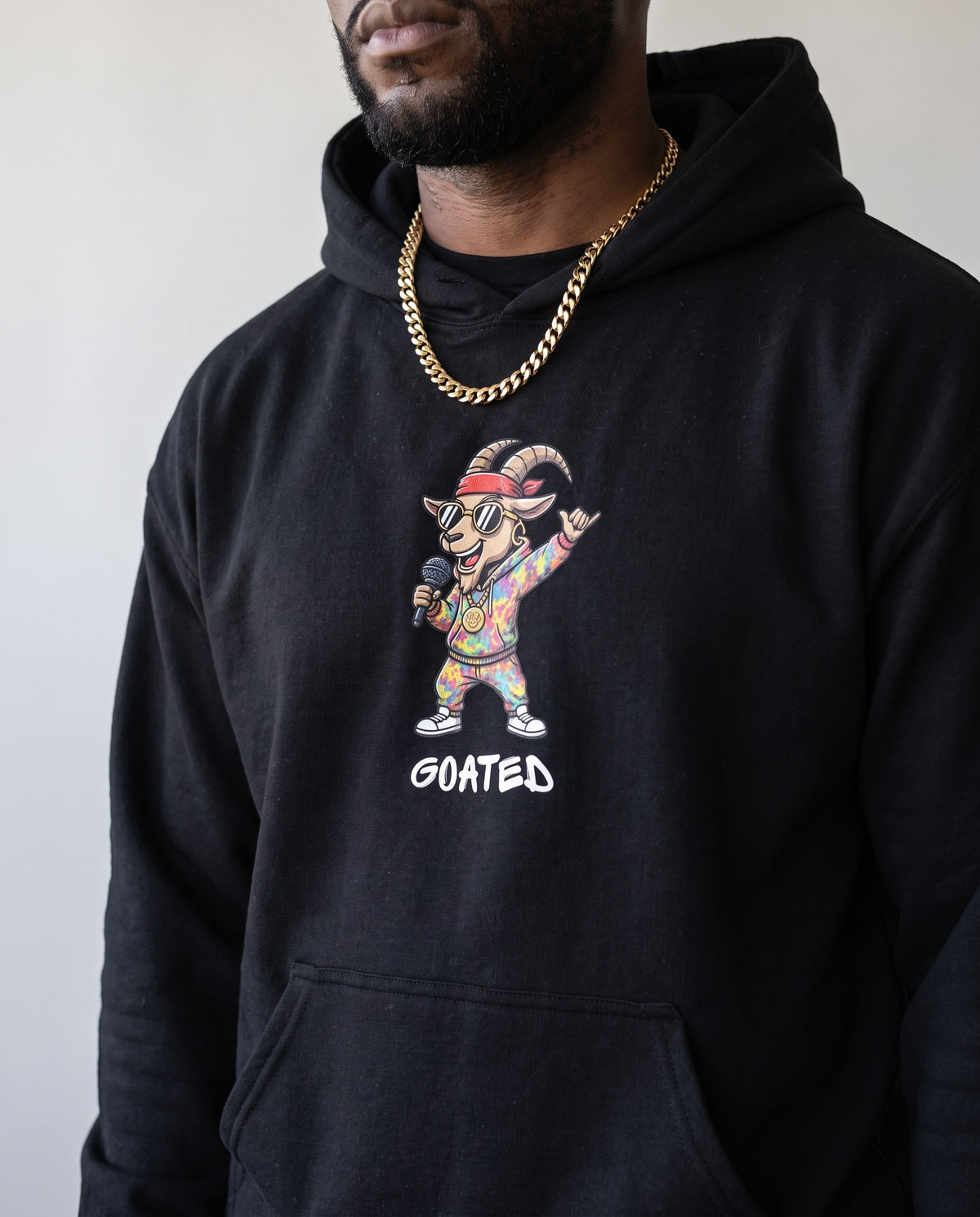 Model wearing the Goated hoodie in Black, print close-up