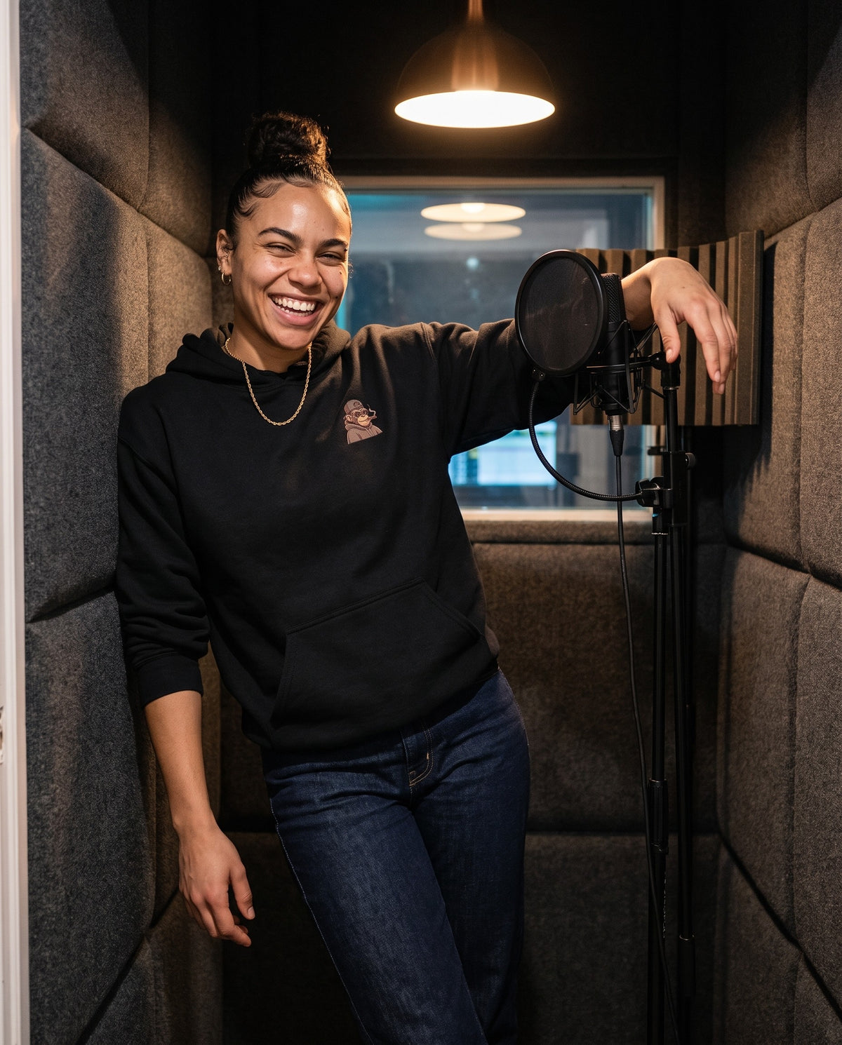 Model wearing the Hip Hop Head Hoodie in Black, in a vocal booth