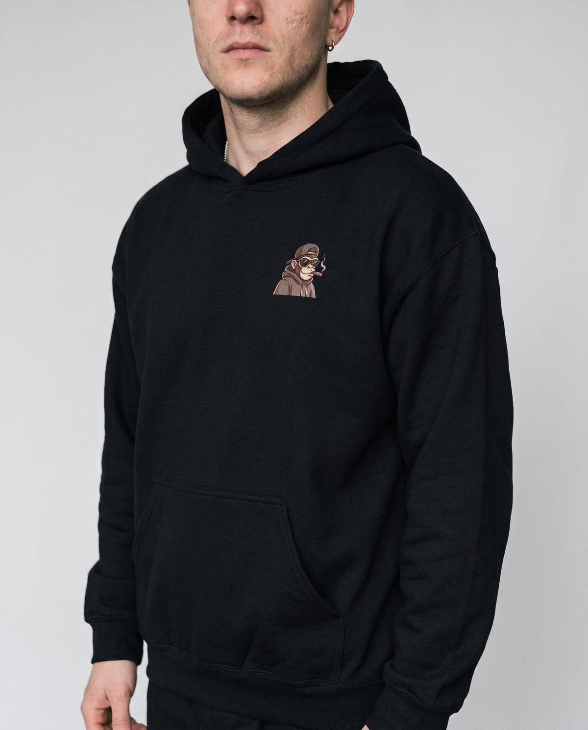 Model wearing the Hip Hop Head Hoodie in Black, print close-up