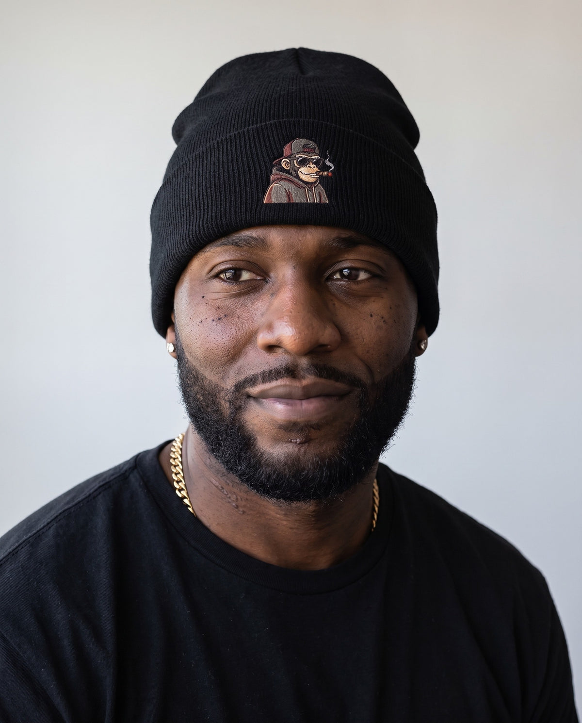 Model wearing the Hip Hop Monkey Beanie in Black, head and shoulders