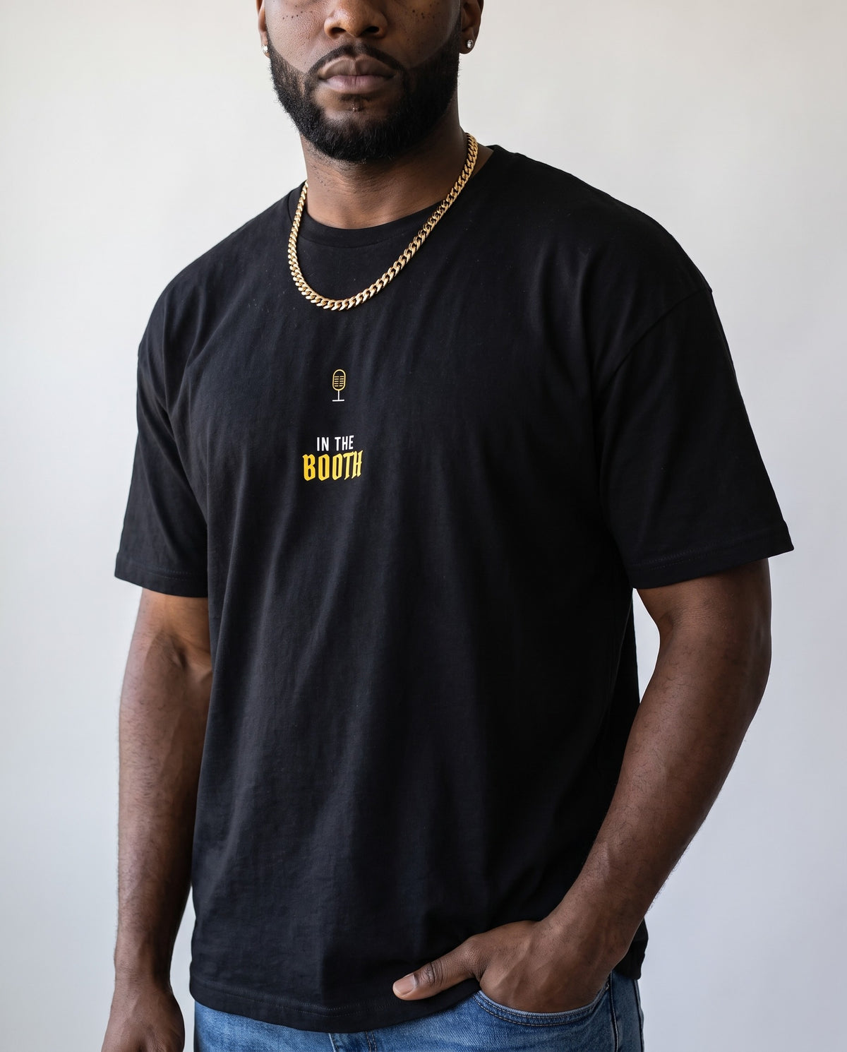 Model wearing the In The Booth t-shirt in Black, print close-up