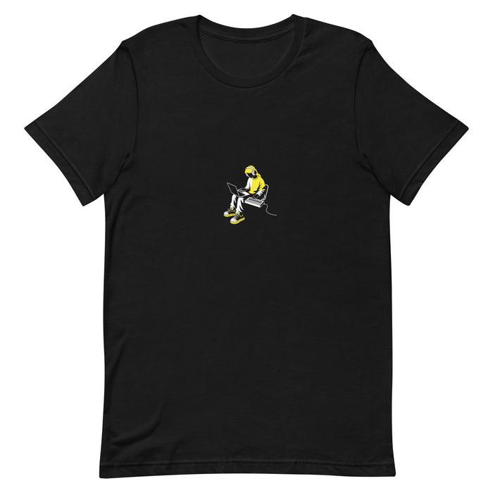 Black t-shirt with a white-and-yellow illustration of a producer making beats on a laptop — Ghostnote music producer tee, flat front