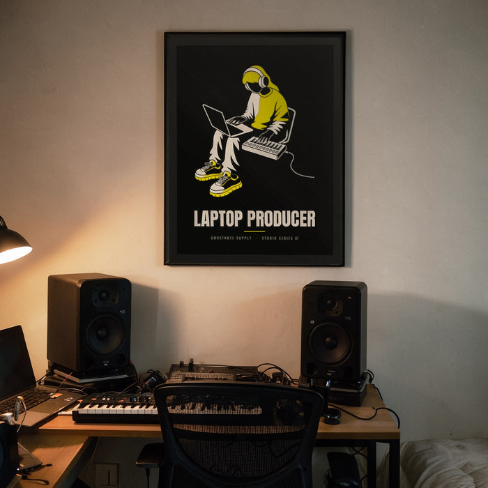 Laptop Producer Studio Poster framed on a home studio wall above a bedroom-studio desk