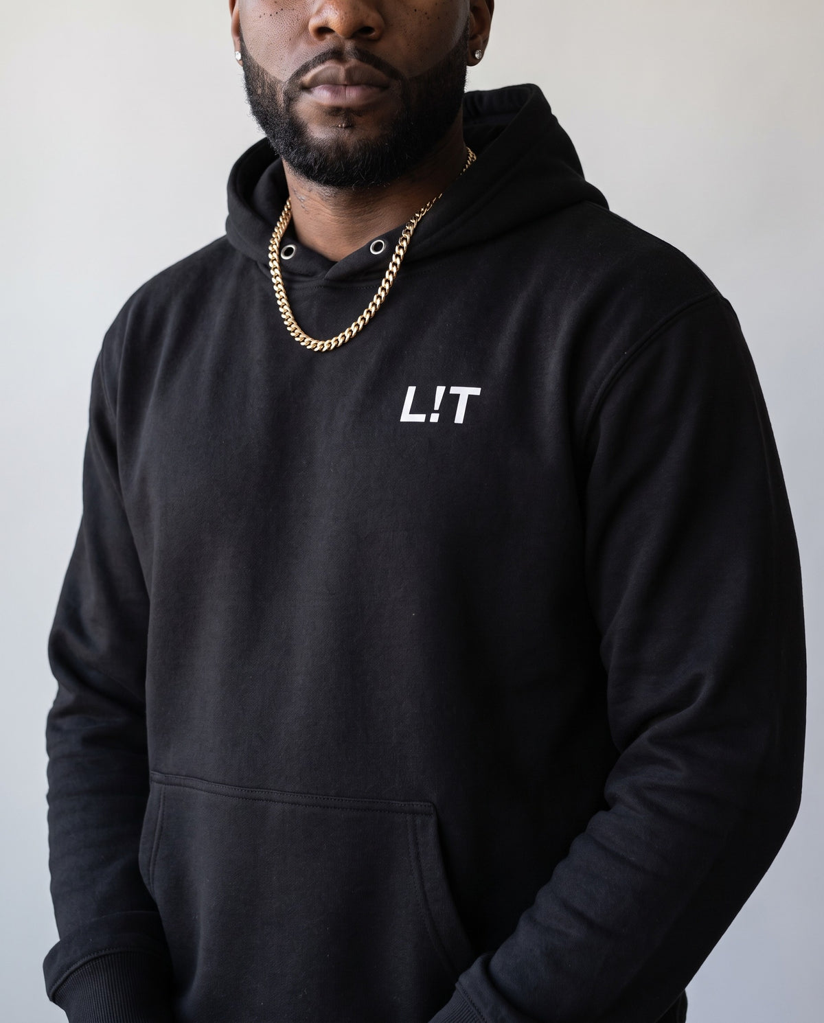 Model wearing the L!T Hoodie in Black, print close-up