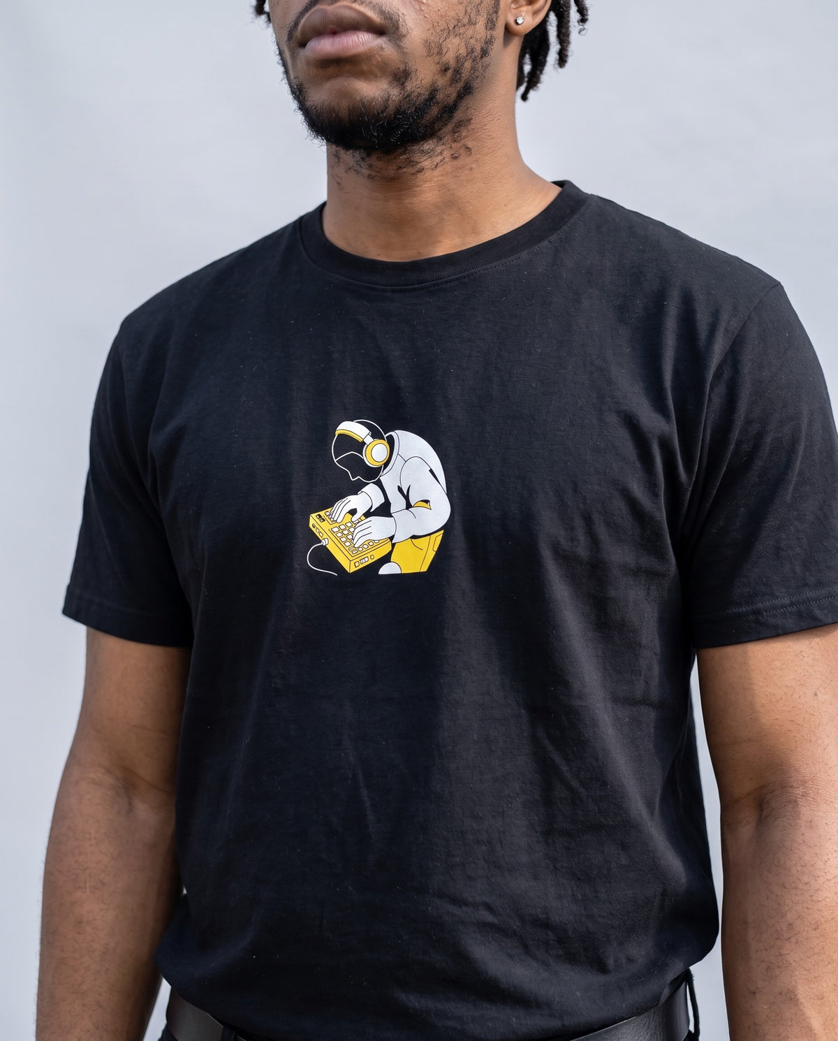 Model wearing the MPC Fingers t-shirt in Black, print close-up