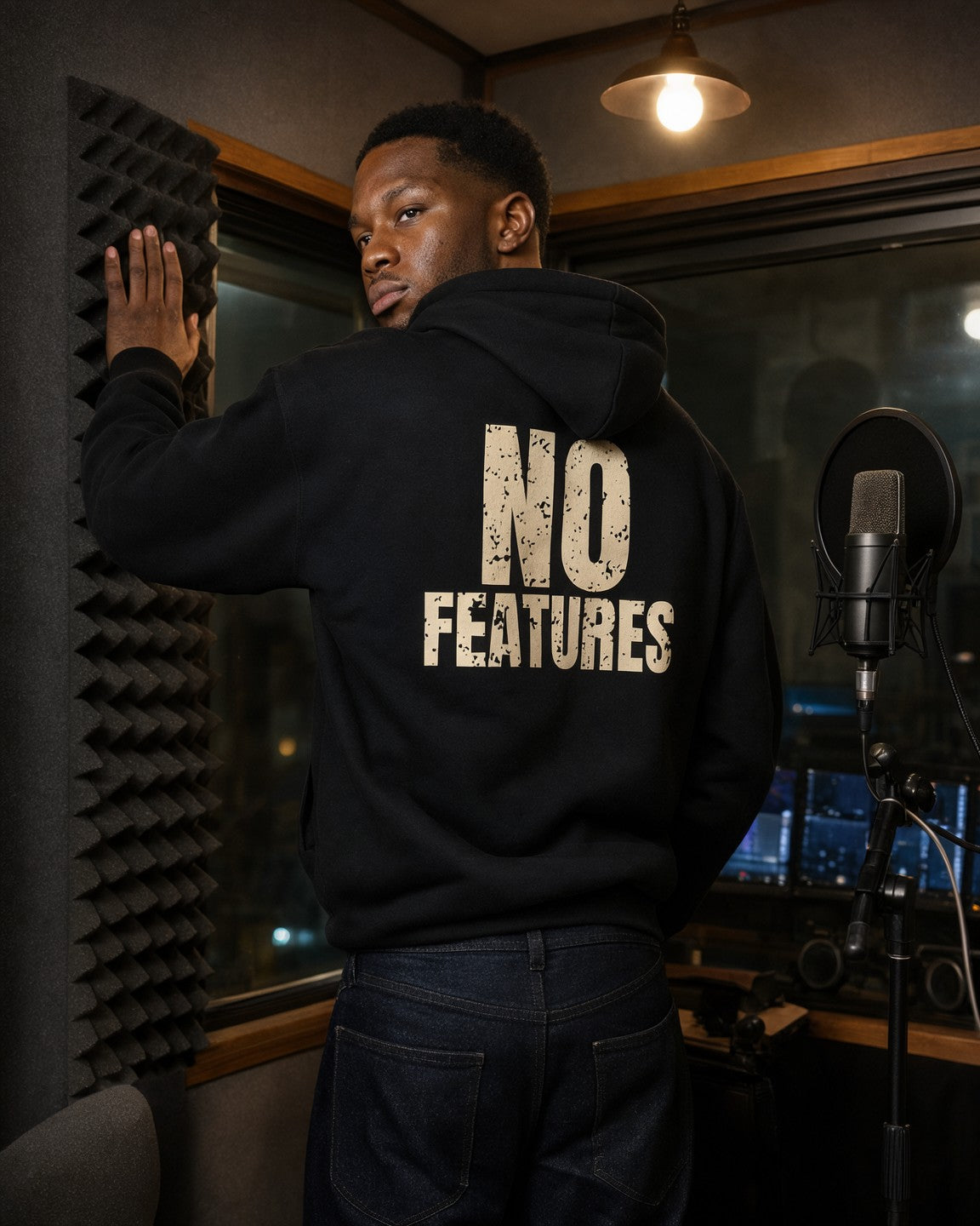 Model wearing the No Features Hoodie in Black