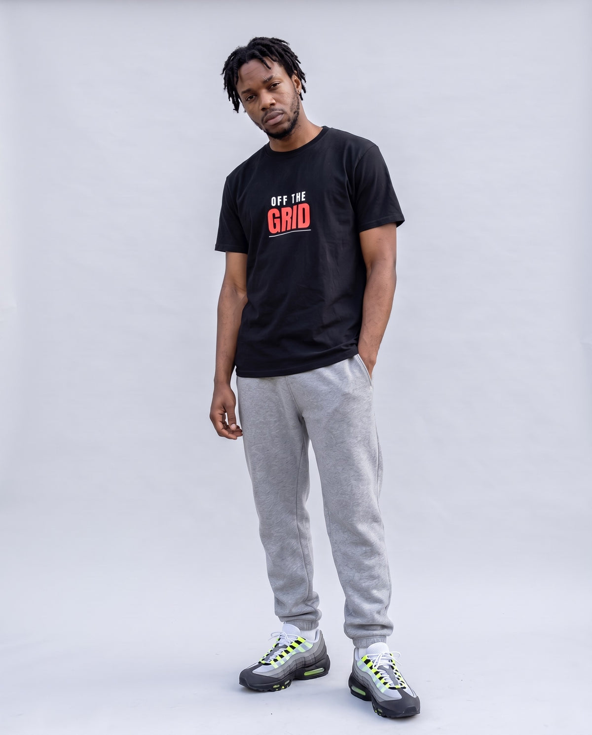 Model wearing the Off The Grid t-shirt in Black, full length