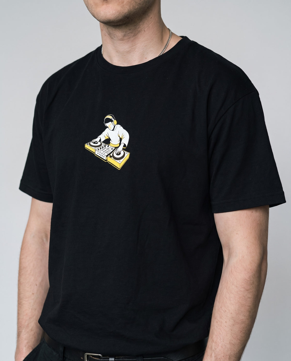 Model wearing the On The Decks t-shirt in Black, print close-up