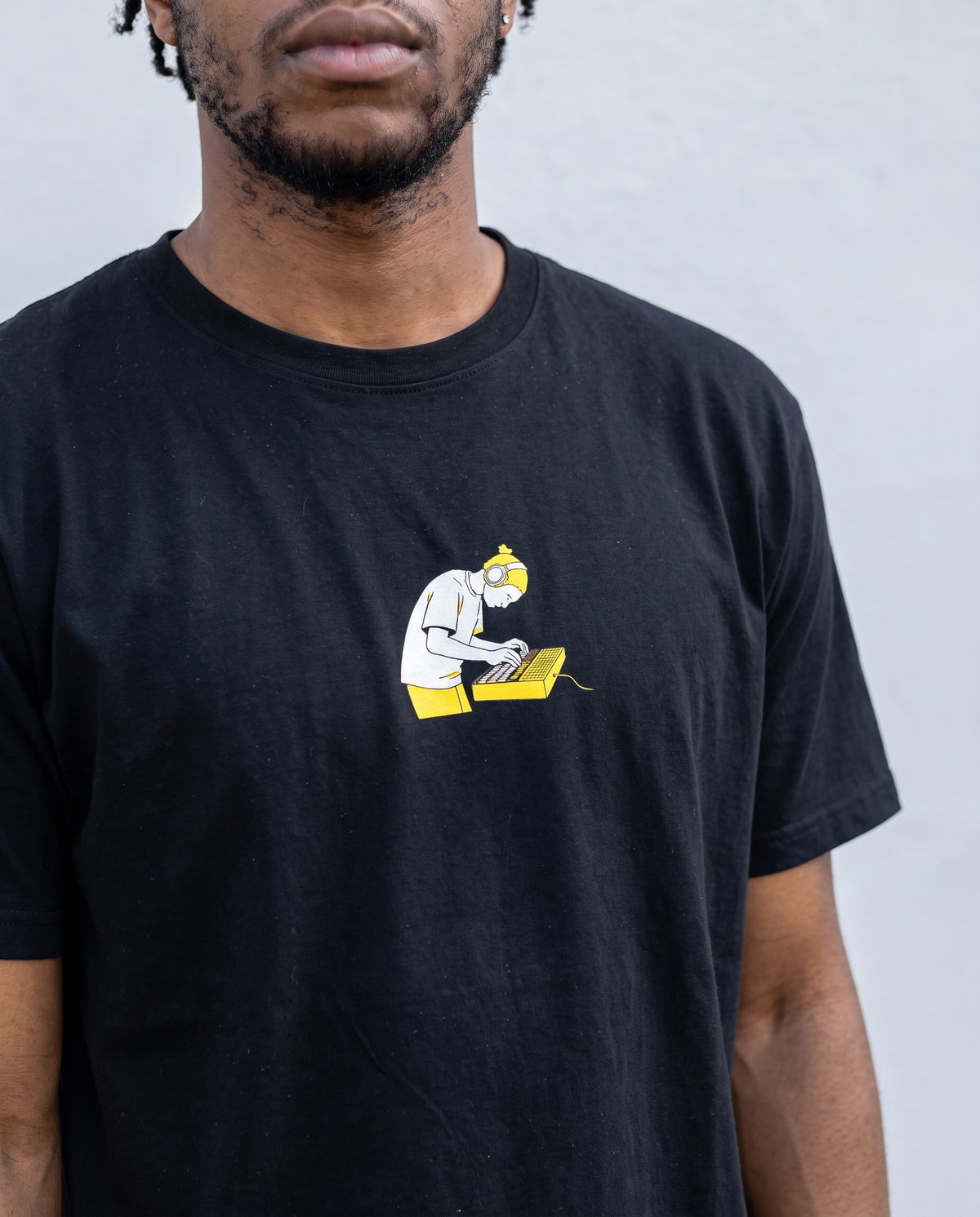 Model wearing the Pad Banger t-shirt in Black, print close-up
