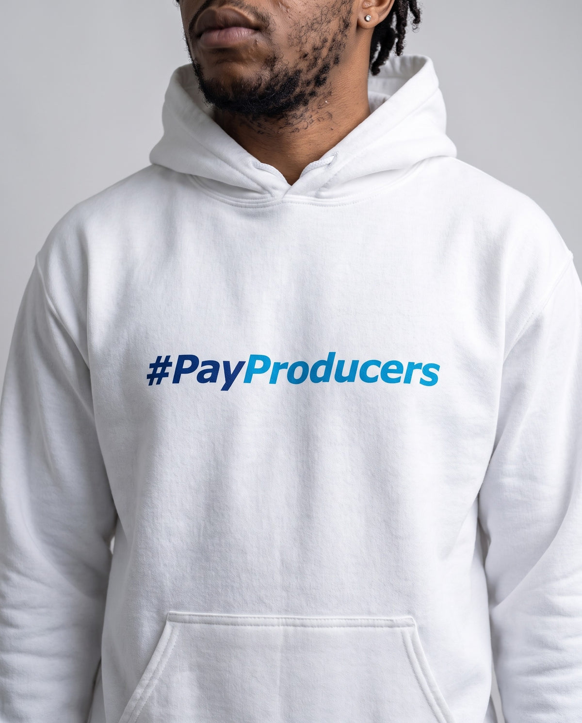 Model wearing the Pay Producer hoodie in White, print close-up