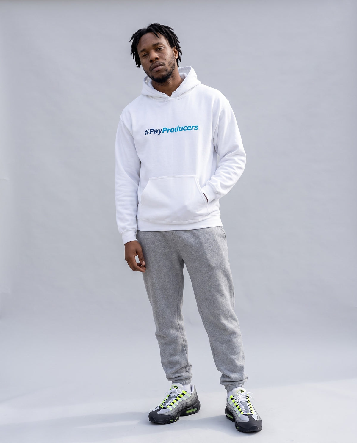 Model wearing the Pay Producer hoodie in White, full length