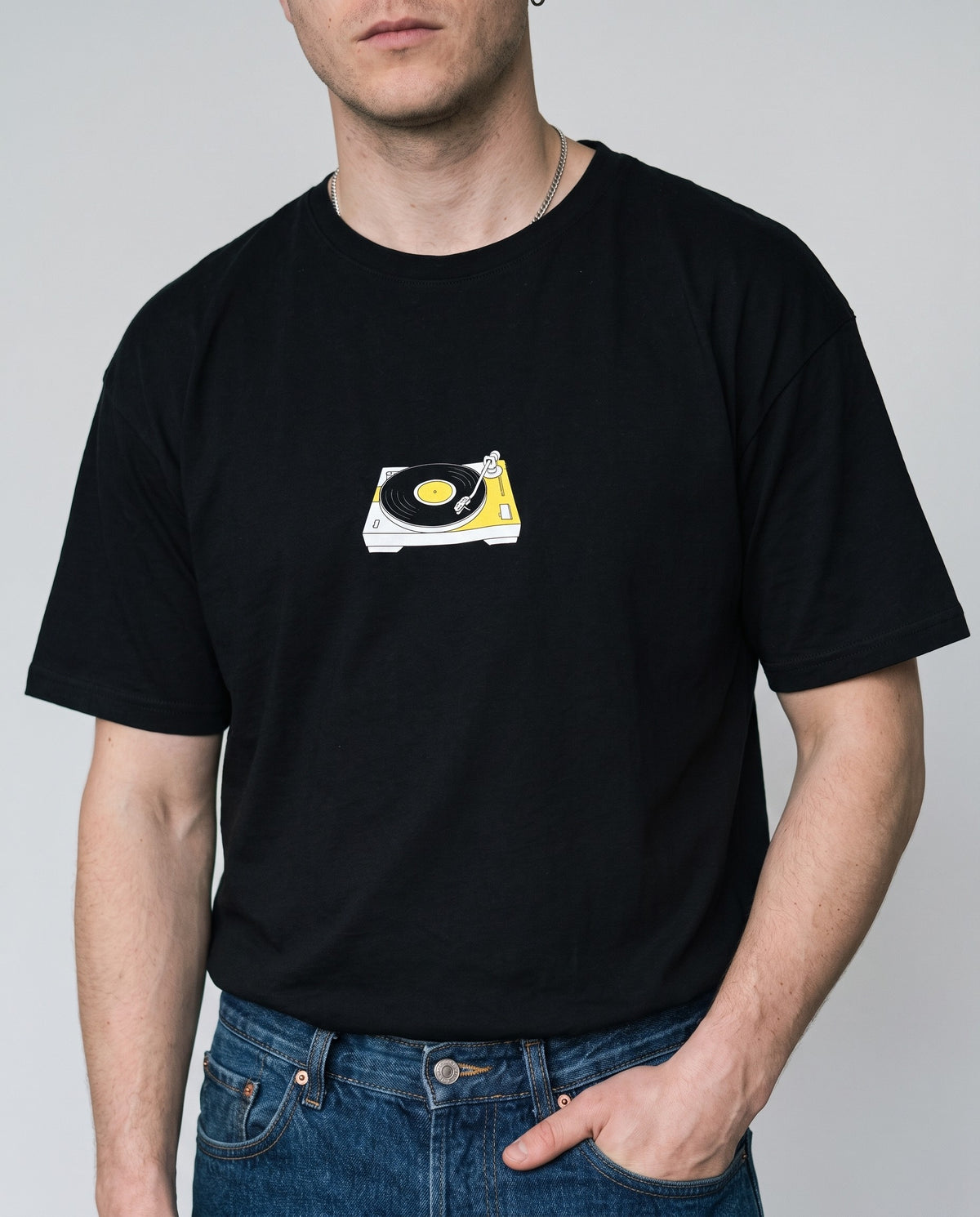 Model wearing the Spin That t-shirt in Black, print close-up
