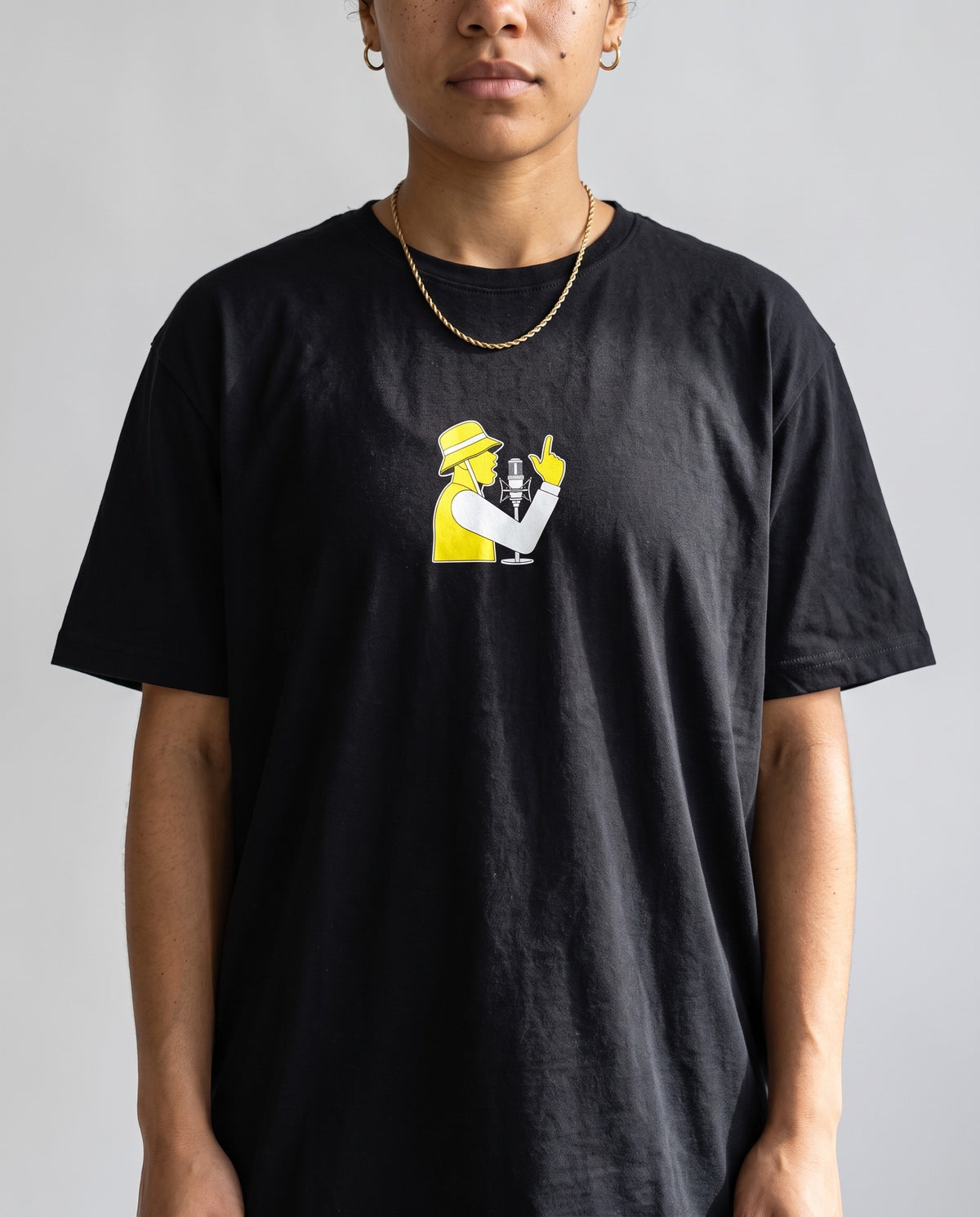 Model wearing the Spit Fire t-shirt in Black, print close-up