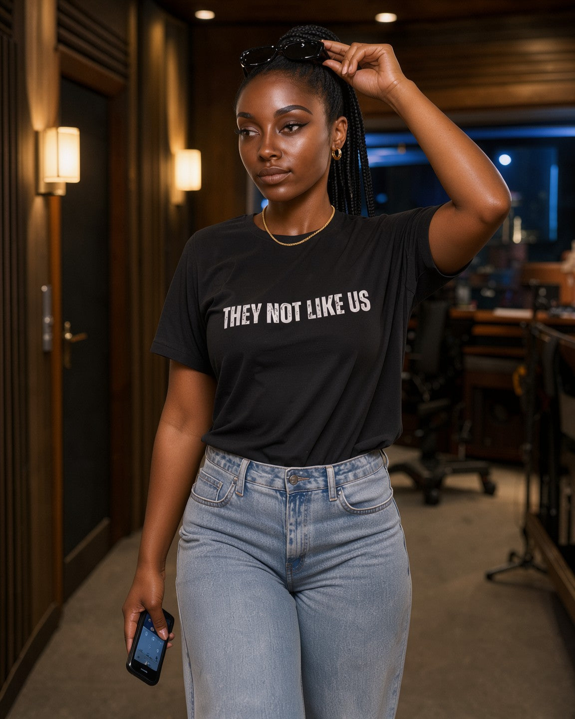 Model wearing the They Not Like Us Women's Tee in Black