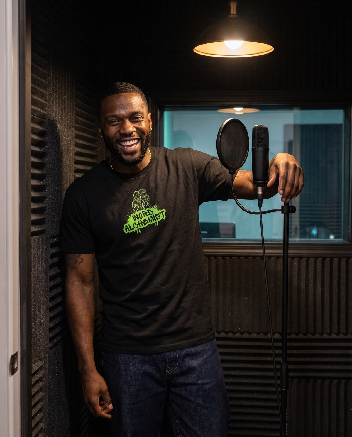 Model wearing the Word Alchemist t-shirt in Black, in a vocal booth