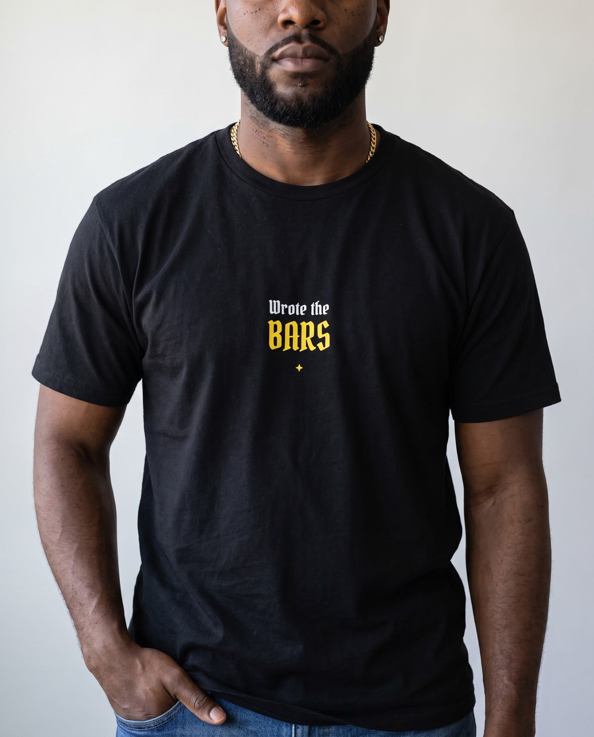 Model wearing the Wrote The Bars t-shirt in Black, print close-up