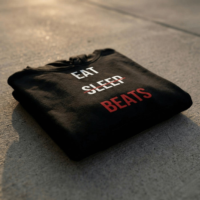Eat Sleep Beats hoodie folded on concrete, a gift for a beatmaker