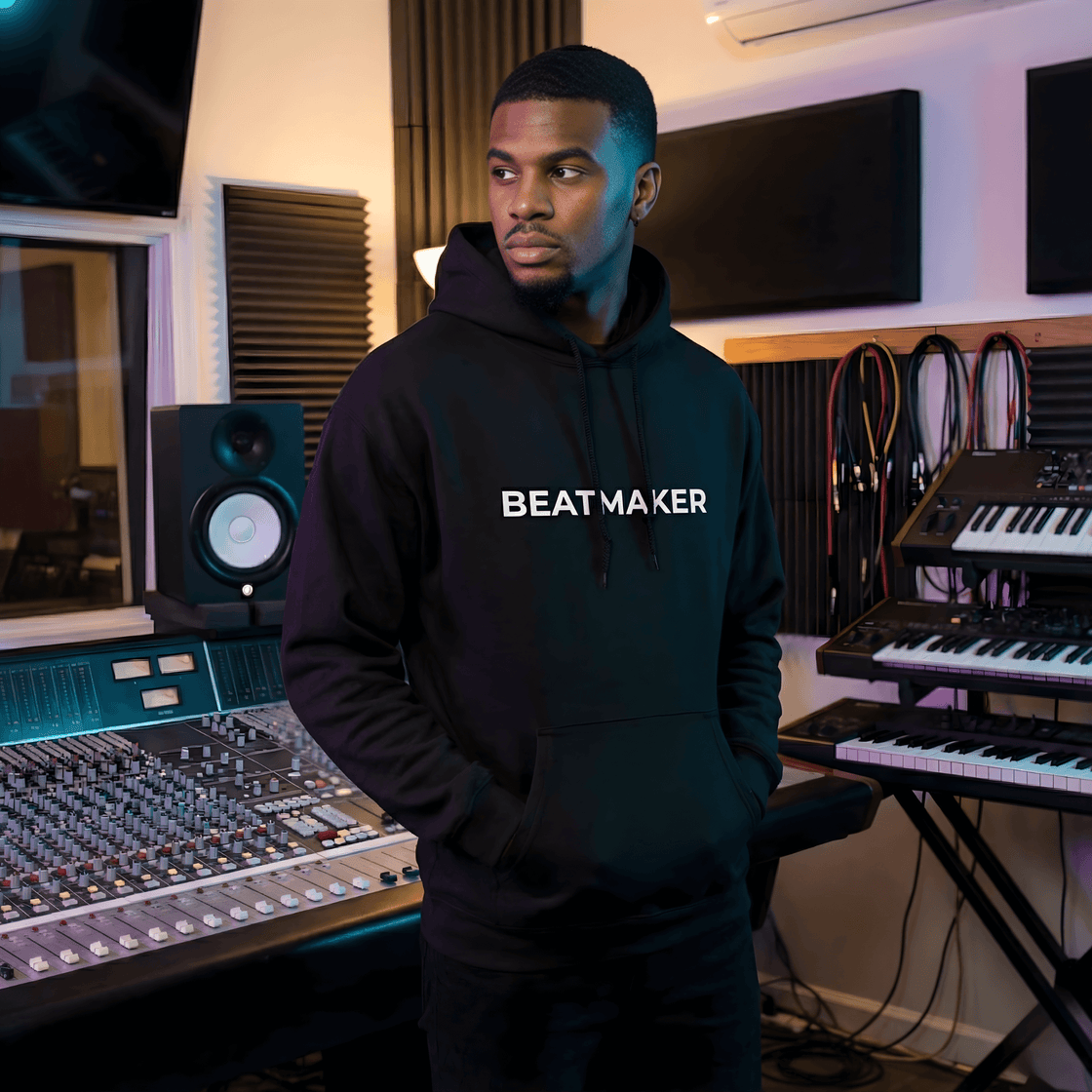 A music producer in a Beatmaker hoodie in a recording studio