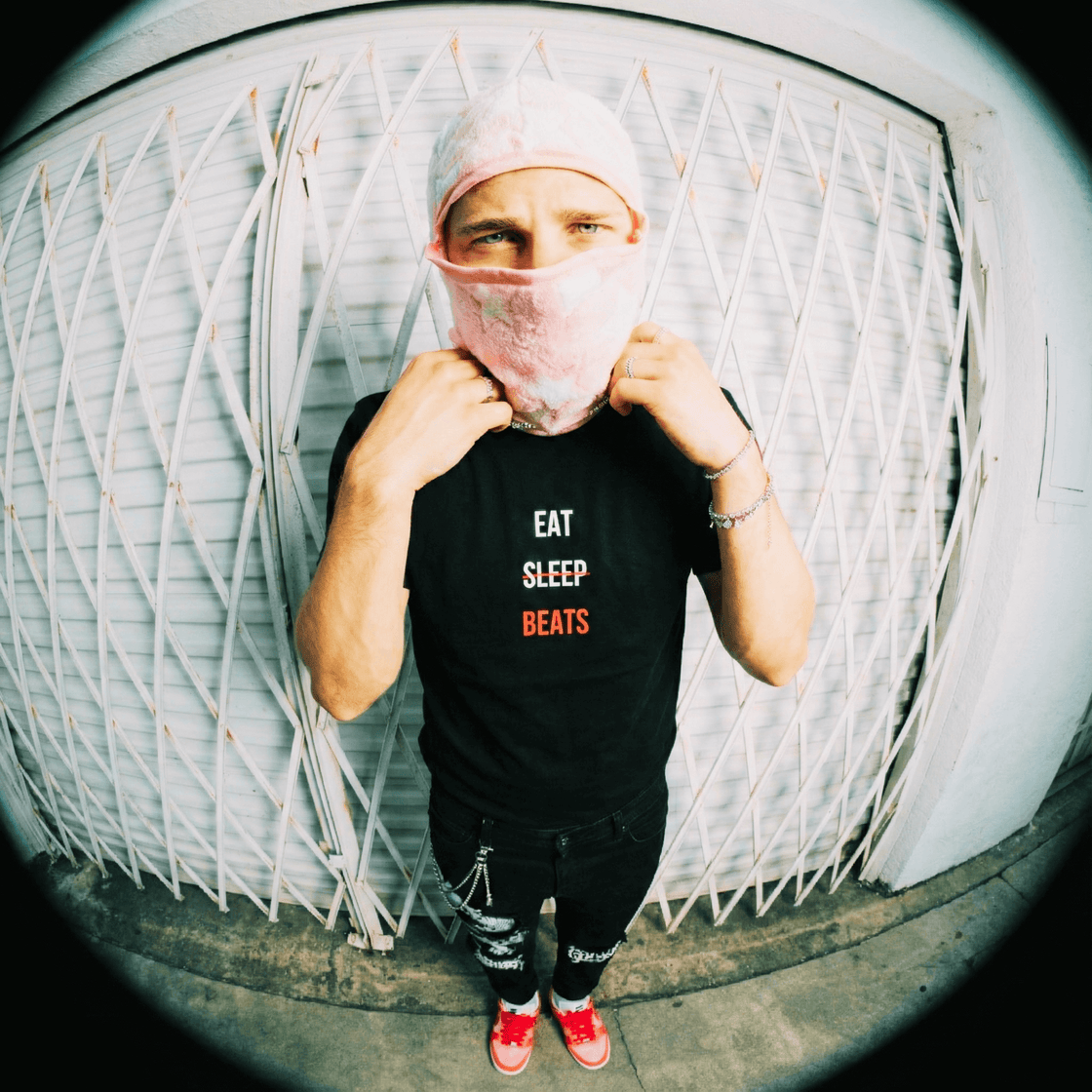 Rapper in an Eat Sleep Beats tee photographed on the street with a fisheye lens