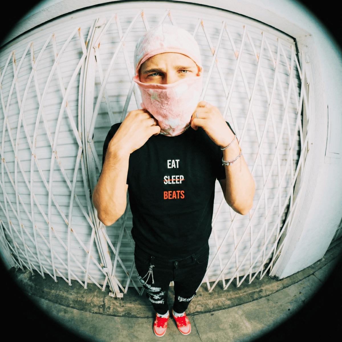 Rapper in an Eat Sleep Beats tee photographed on the street with a fisheye lens