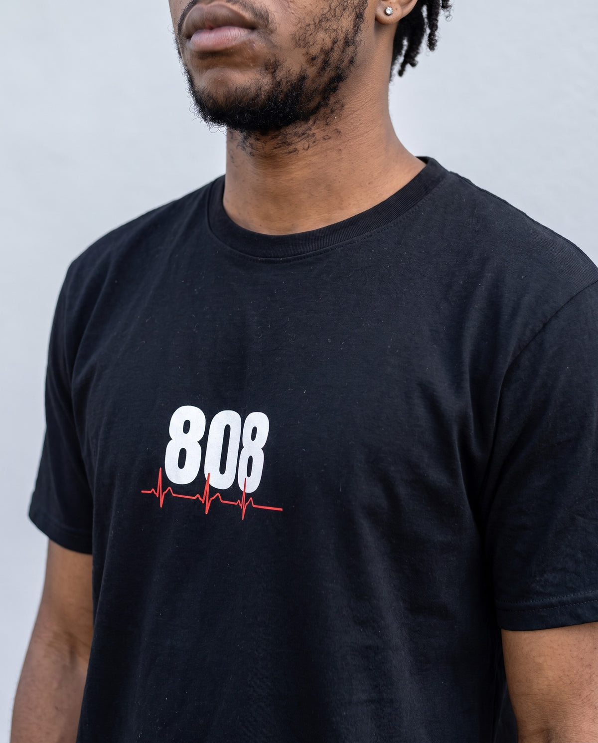 Model wearing the 808 Is My Heartbeat t-shirt in Black, print close-up