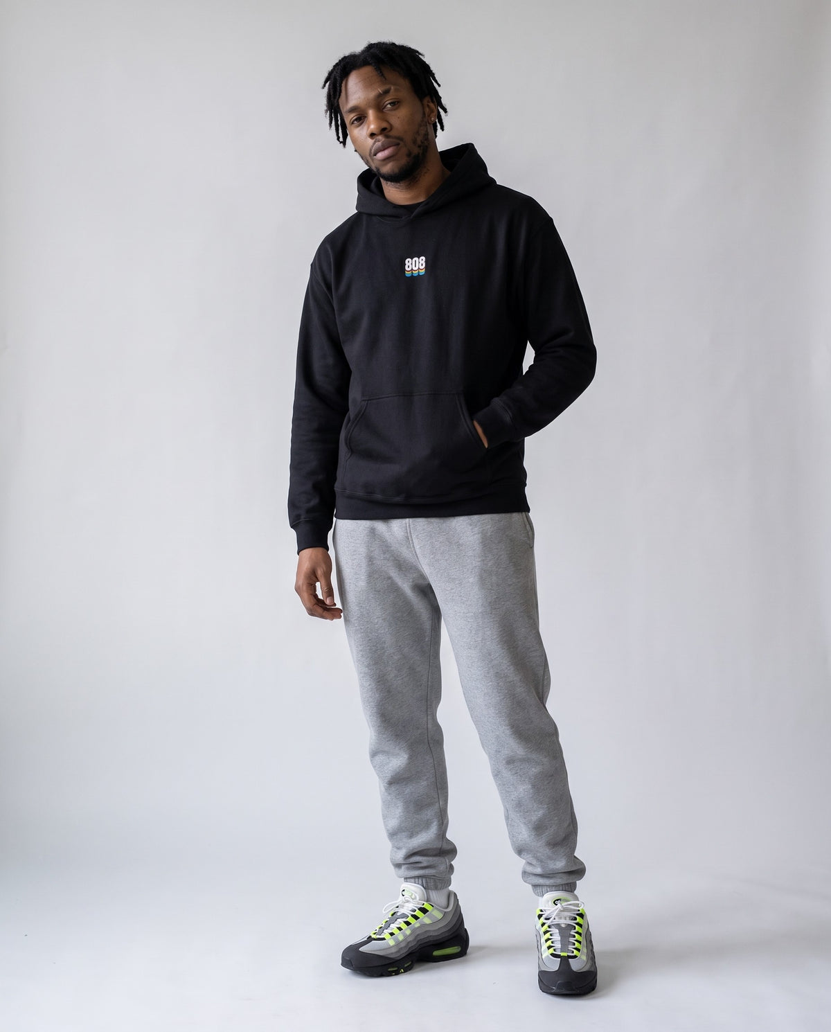 Model wearing the 808 hoodie in Black, full length