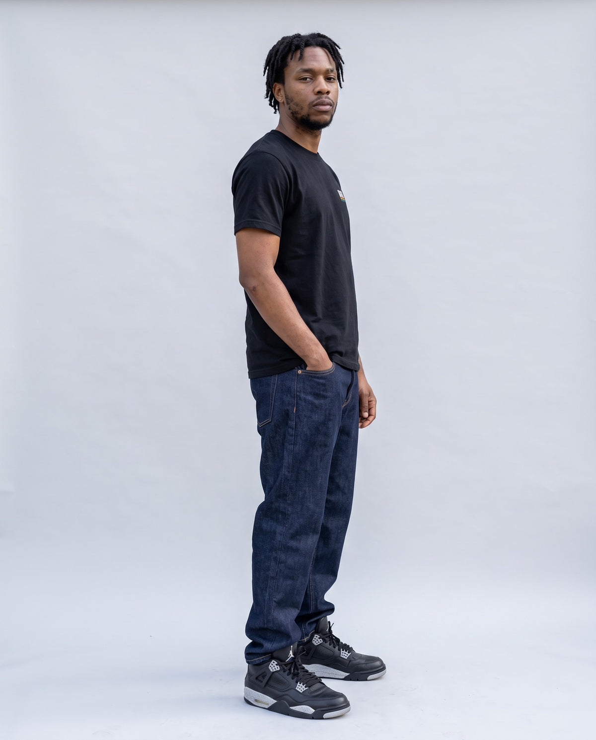Model wearing the 808 t-shirt in Black, side profile