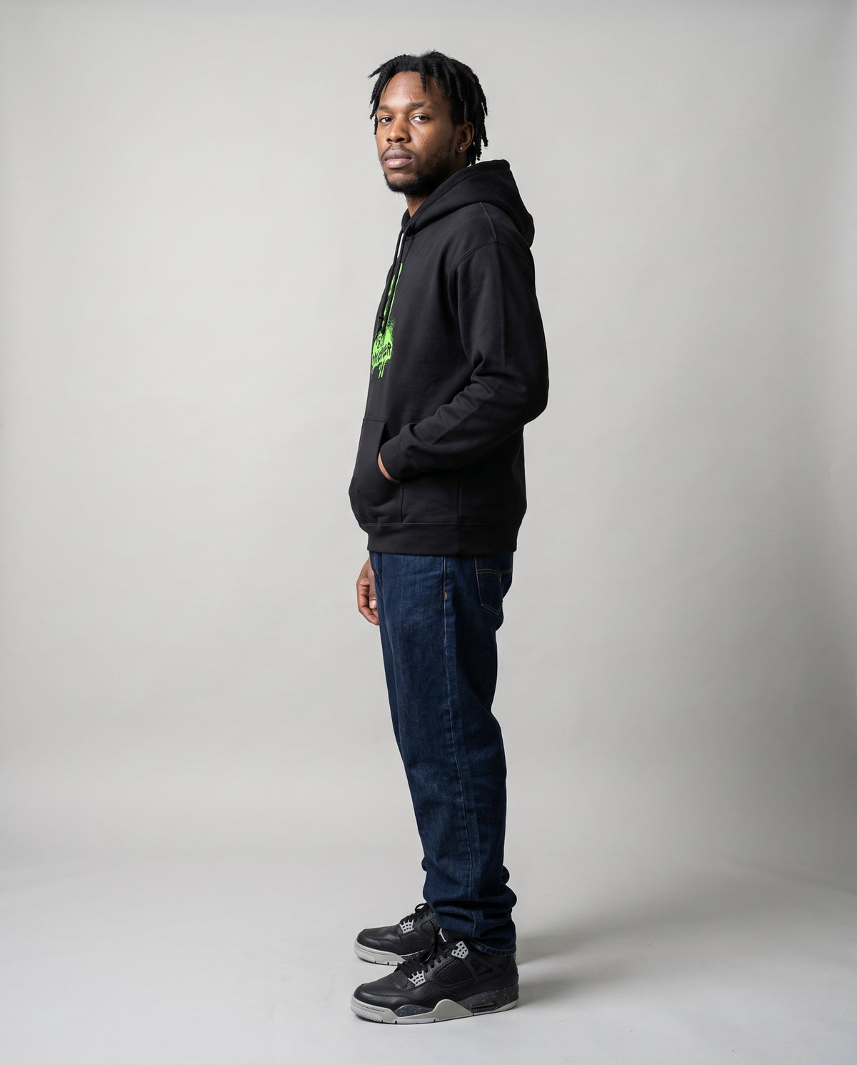 Model wearing the 808 Sorcerer hoodie in Black, side profile