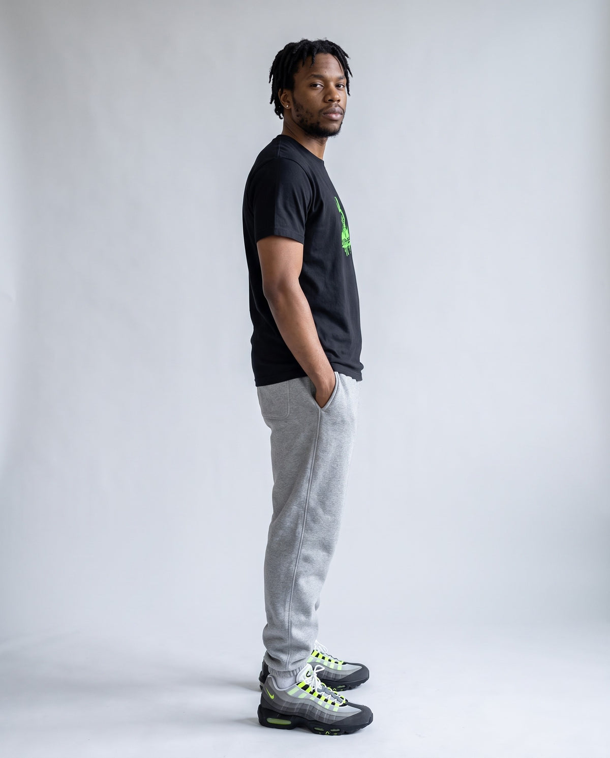 Model wearing the 808 Sorcerer t-shirt in Black, side profile