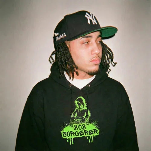 Music producer wearing a 808 sorcerer  Ghostnote hoodie