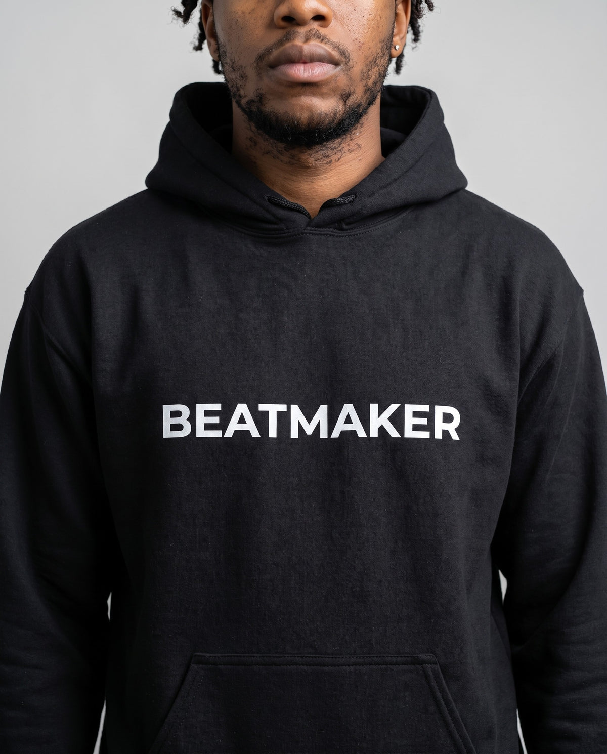 Model wearing the Beatmaker Hoodie in Black, print close-up
