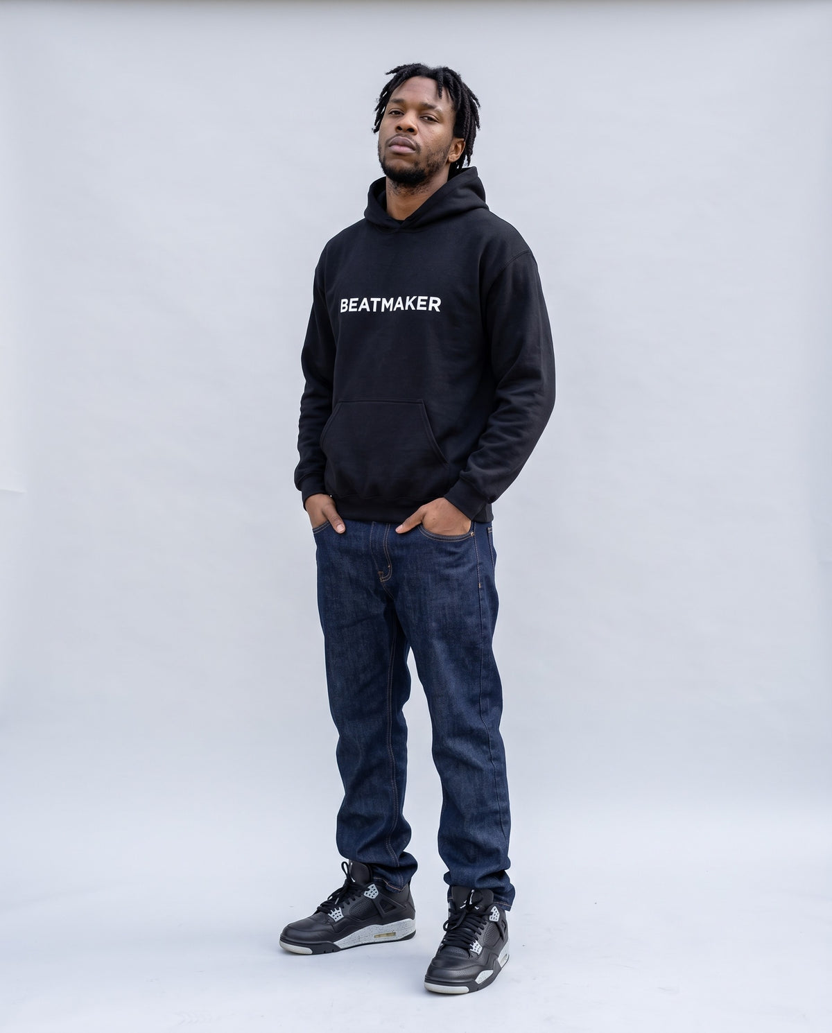 Model wearing the Beatmaker Hoodie in Black, full length