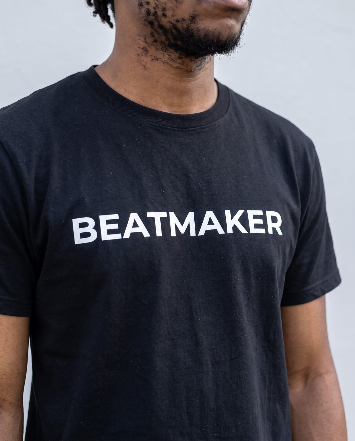 Model wearing the Beatmaker t-shirt in Black, print close-up