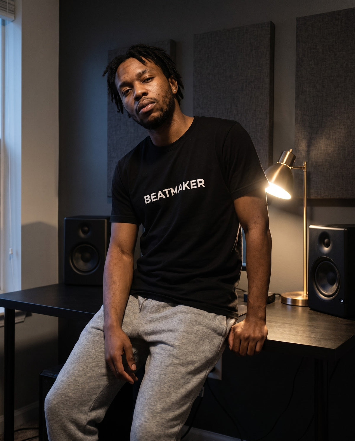 Model wearing the Beatmaker t-shirt in Black, in a home studio