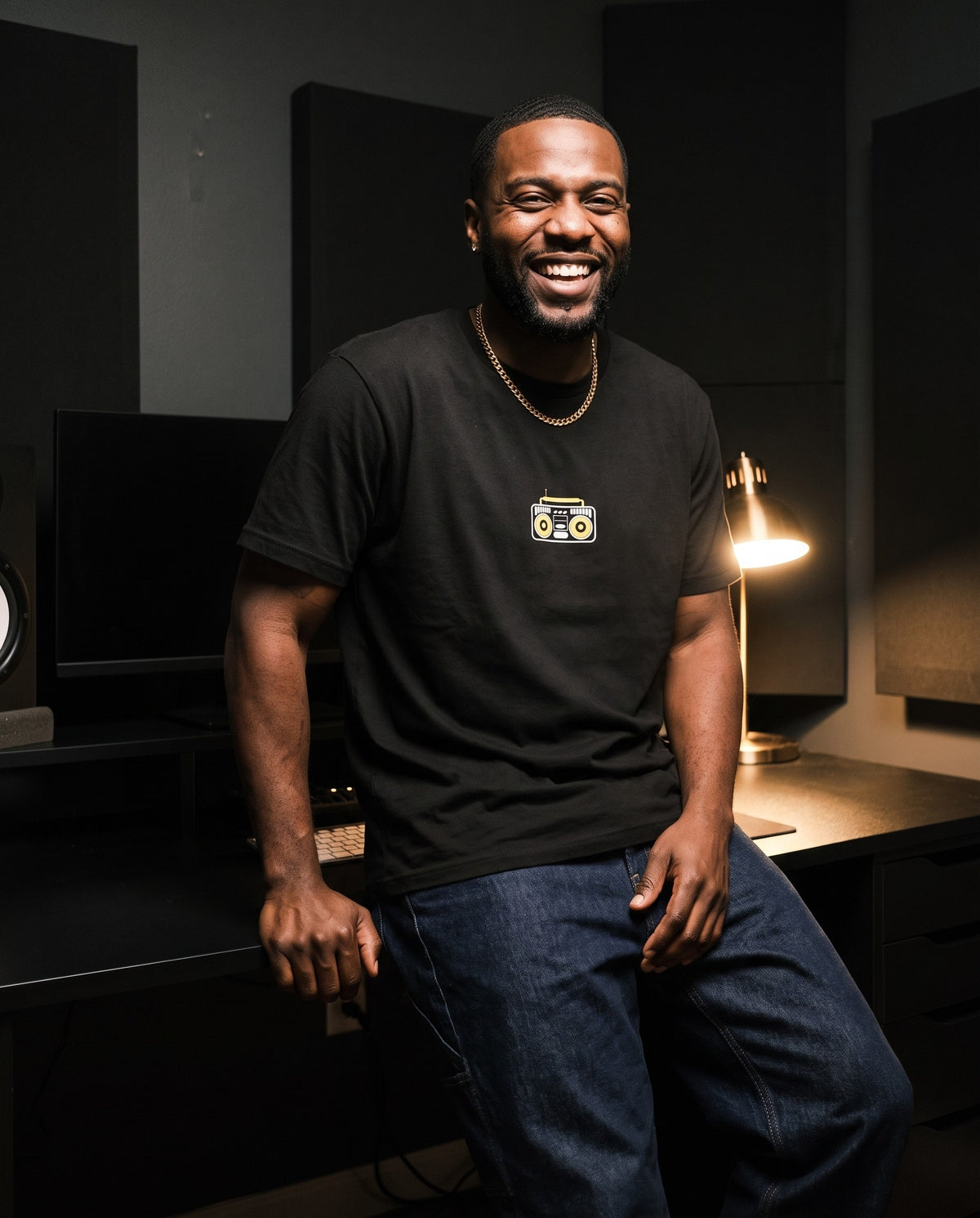 Model wearing the Boombox t-shirt in Black, in a home studio