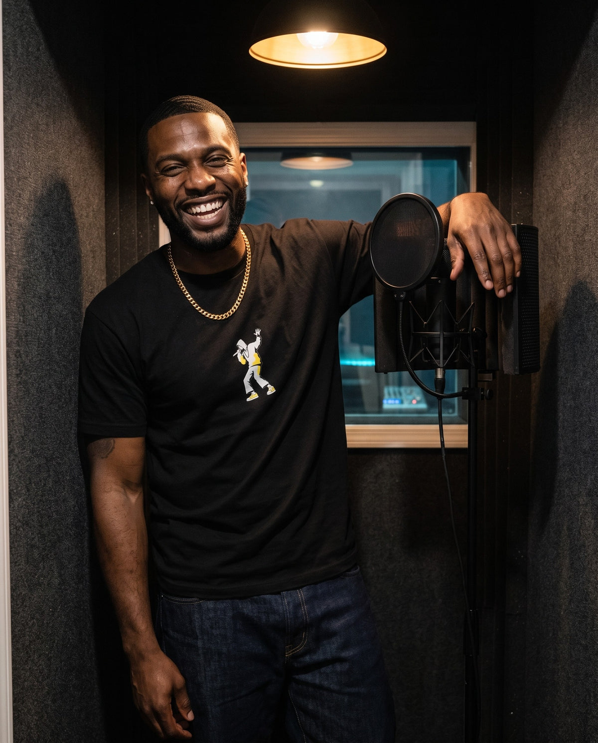 Model wearing the Center Stage t-shirt in Black, in a vocal booth