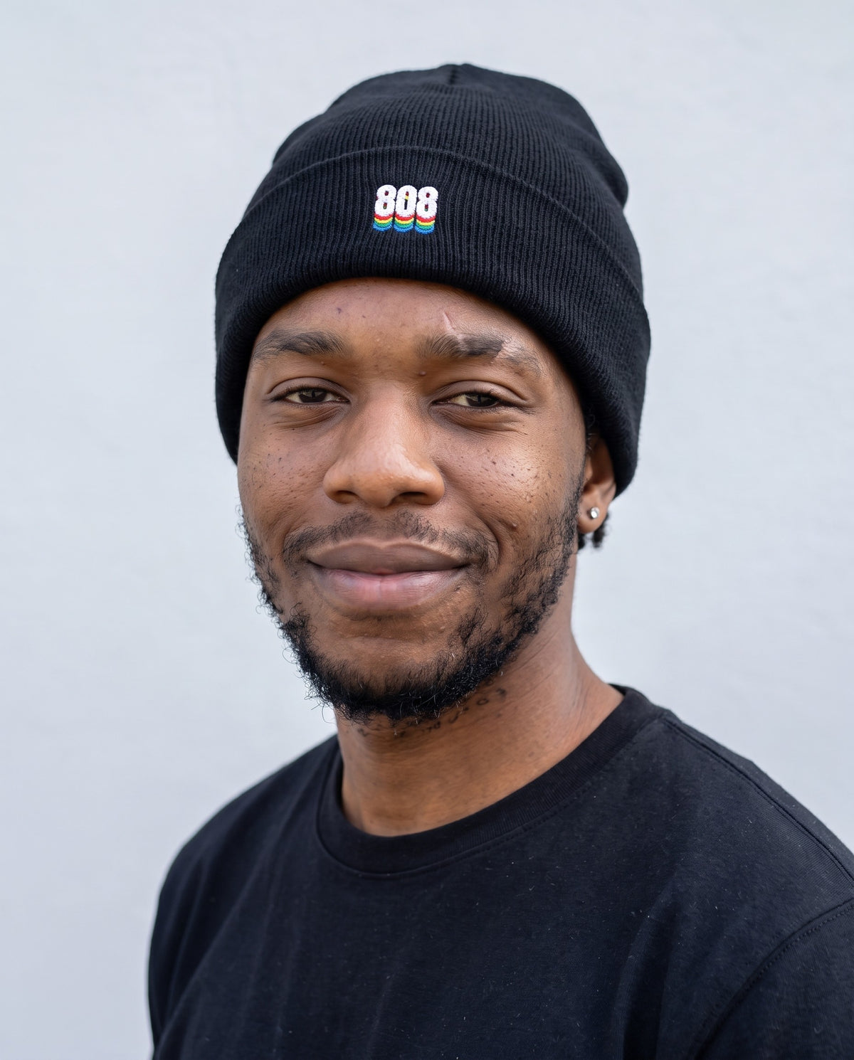Model wearing the 808 Sound Black Beanie in Black, head and shoulders