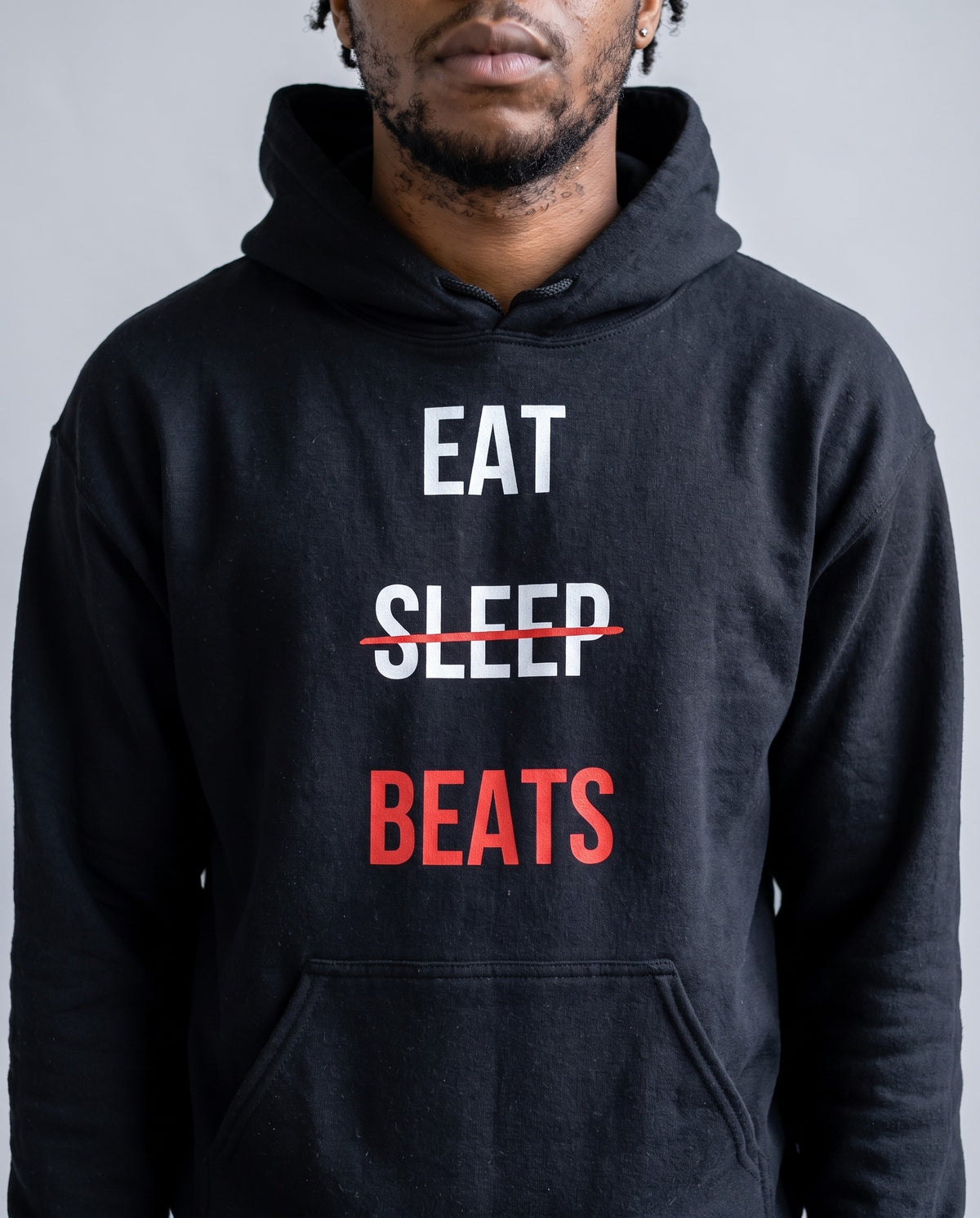 Model wearing the Eat Sleep Beats Producer Hoodie in Black, print close-up