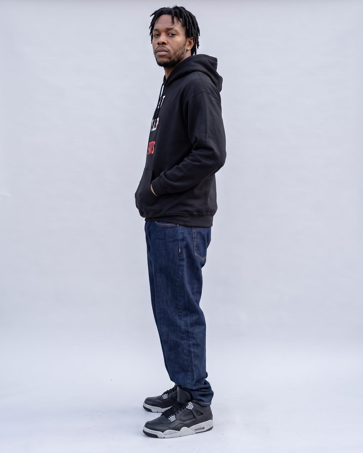 Model wearing the Eat Sleep Beats Producer Hoodie in Black, side profile