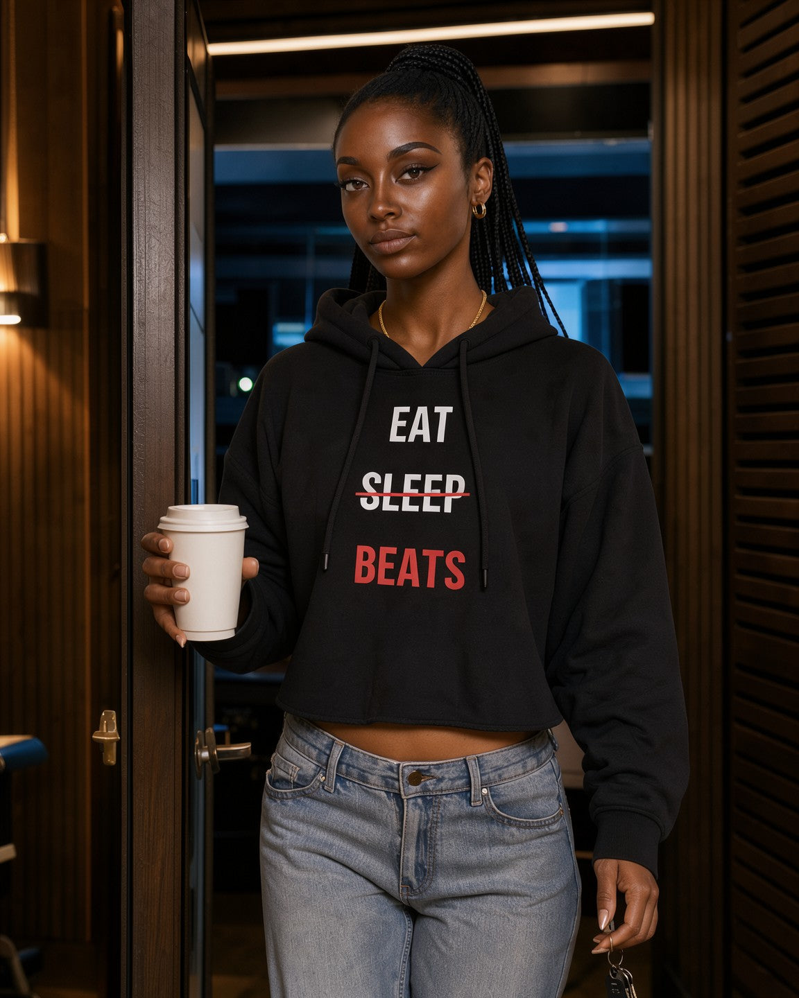 Model wearing the Eat Sleep Beats Women's Cropped Hoodie in Black