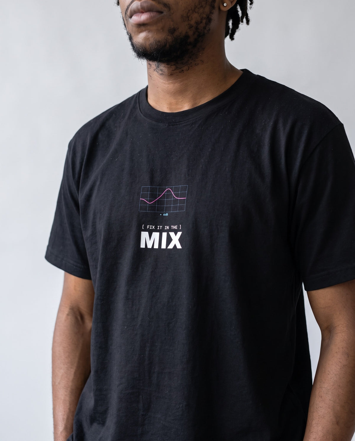 Model wearing the Fix It In The Mix t-shirt in Black, print close-up