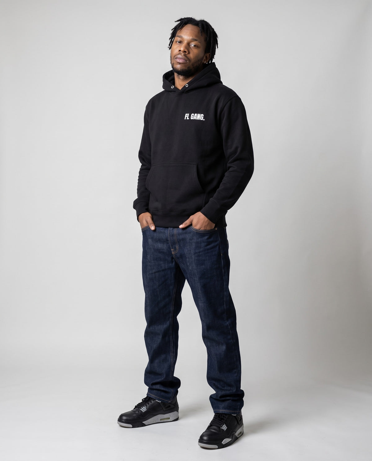 Model wearing the FL Gang Premium Hoodie in Black, full length